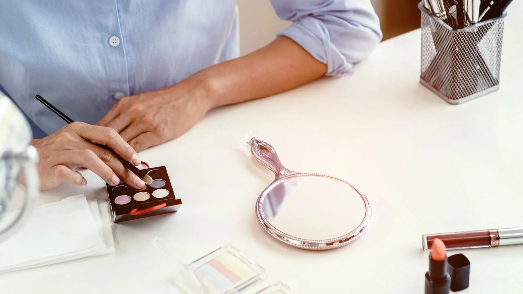 Cosmetic compliance review with product samples on desk.