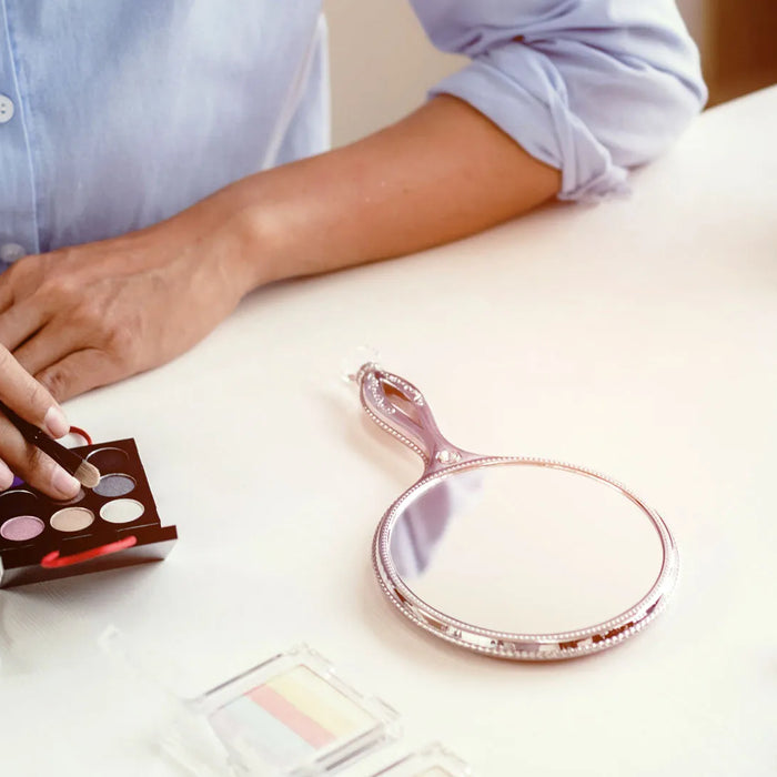 Cosmetic compliance review with product samples on desk.