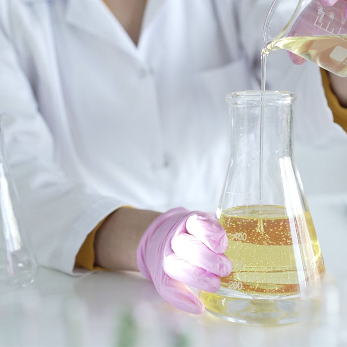 Cosmetic lab testing formulation with glassware and pipette for CPSR assessment and compliant cosmetic labeling