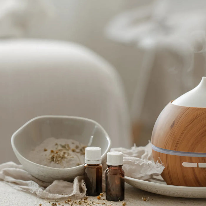 Essential oils and aroma diffuser displayed for fragrance safety assessment and UK and EU cosmetic compliance.