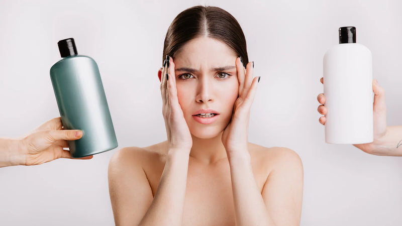 Woman comparing hair care products and shampoo while evaluating cosmetic product claims and ingredients.