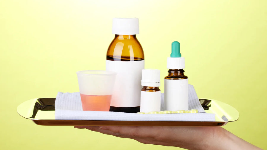 Tray of medicine and dropper bottles, illustrating borderline cosmetic vs medicine product classification