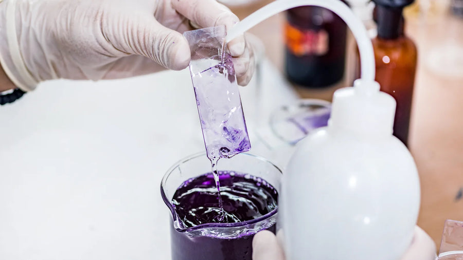 Lab technician testing a cosmetic sample, illustrating OPSS enforcement and UK CPSR compliance checks