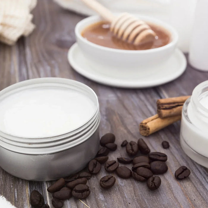 Whipped shea body butter in cosmetic jars for deep skin hydration and nourishment.