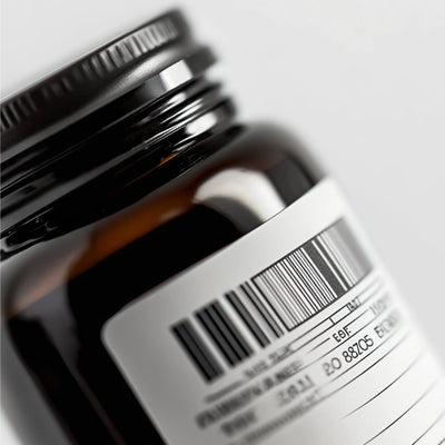Medical device label and UDI barcode review: close-up of an amber bottle with barcode label